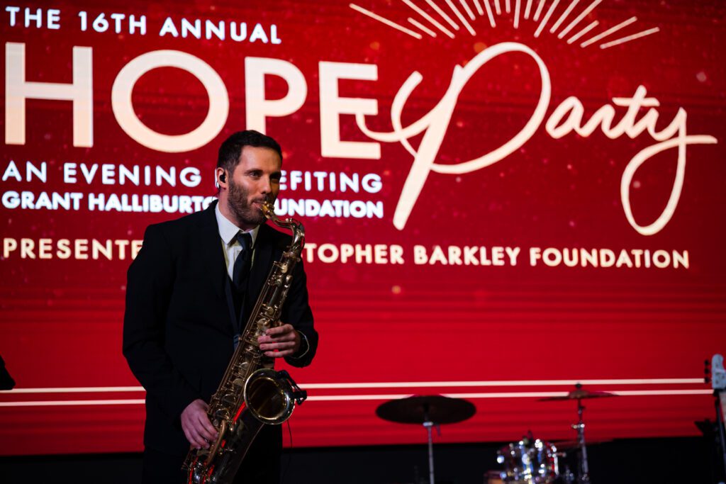 Evan Knight played the saxophone while guests enjoyed their dinner (Photo by Simon Luna Studios)