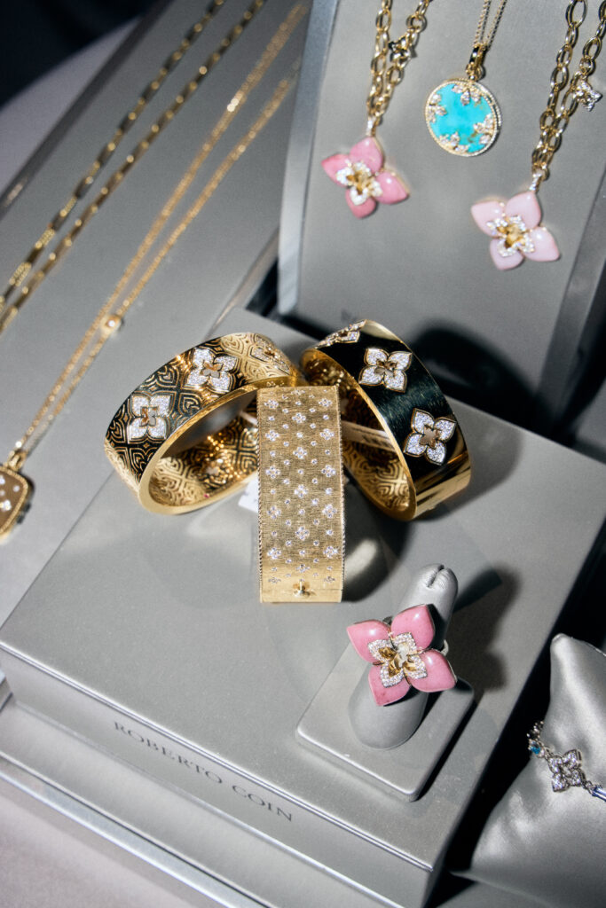 Between courses, guests couldn't resist the temptation to do a little Roberto Coin shopping. (Photo by Luis Martinez Photography)