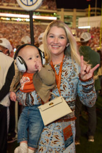 Bailey Bell Layne with son Hudson at the 2025 Lone Star Showdown; photo courtesy of Cotton Holdings