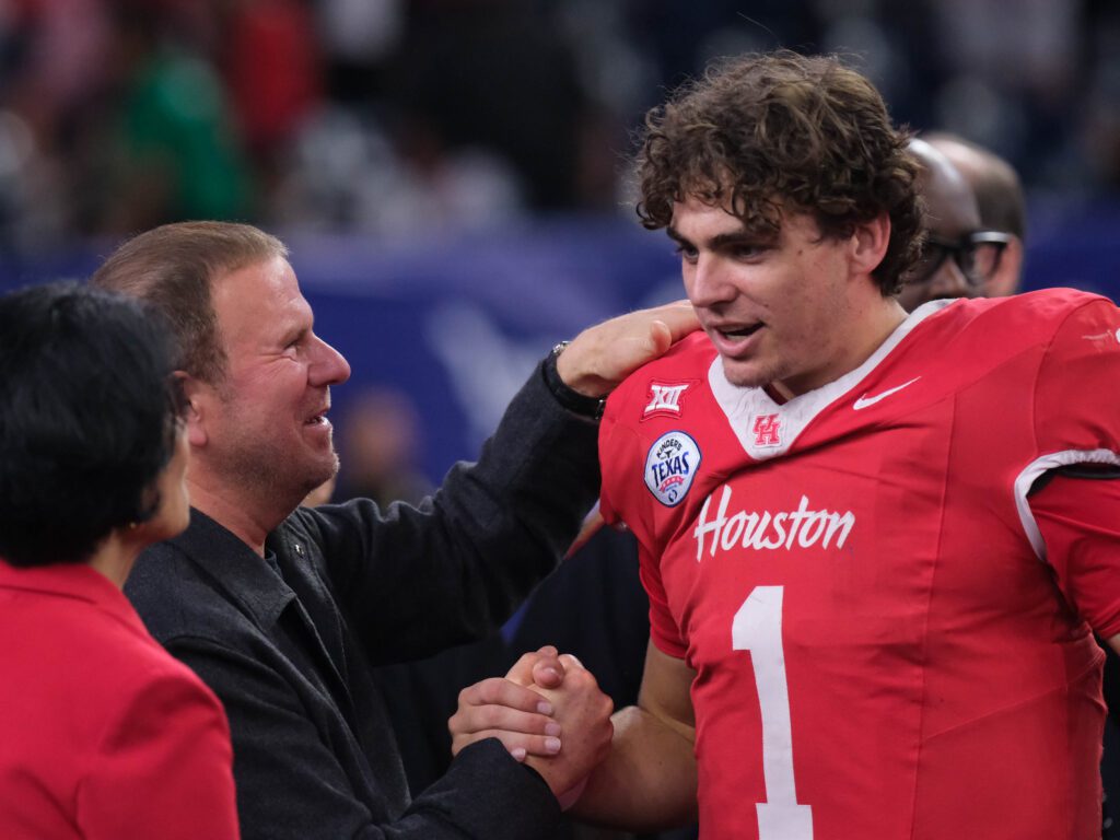 University of Houston quarterback Conner Weigman got congratulations from Tilman Fertitta and Renu Khator. (Photo by F. Carter Smith)