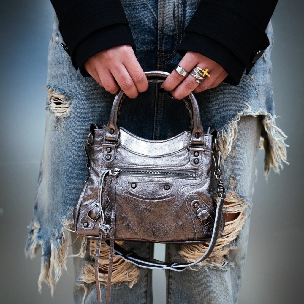 Balenciaga Neo Cagole mini handbag in metallic silver. This style is a modern take on the brand's classic City Bag from the early 2000s. Luxury handbags finds are one of the calling cards of 2nd Street USA.