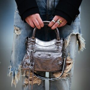 Balenciaga Neo Cagole mini handbag in metallic silver. This style is a modern take on the brand’s classic City Bag from the early 2000s. Luxury handbags finds are one of the calling cards of 2nd Street USA.