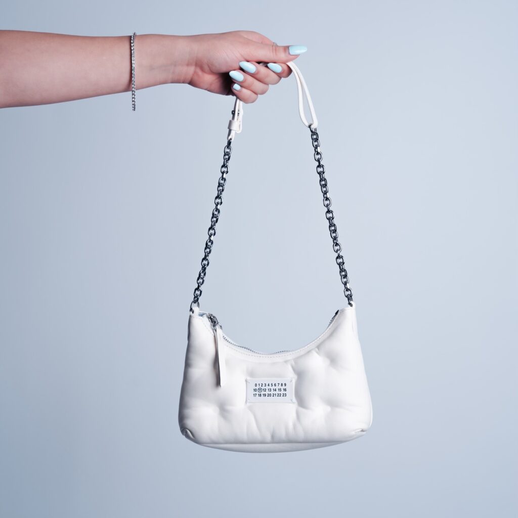 Purse Score: Maison Margiela Glam Slam Hobo Micro bag in white nappa leather with a chain strap, sold at 2nd Street USA. Luxury handbags are one of the alluring categories carried by 2nd Street. 