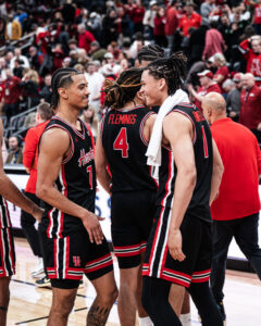 University of Houston guards Milos Uzan and Isiah Harwell celebrate the win over Arkansas.