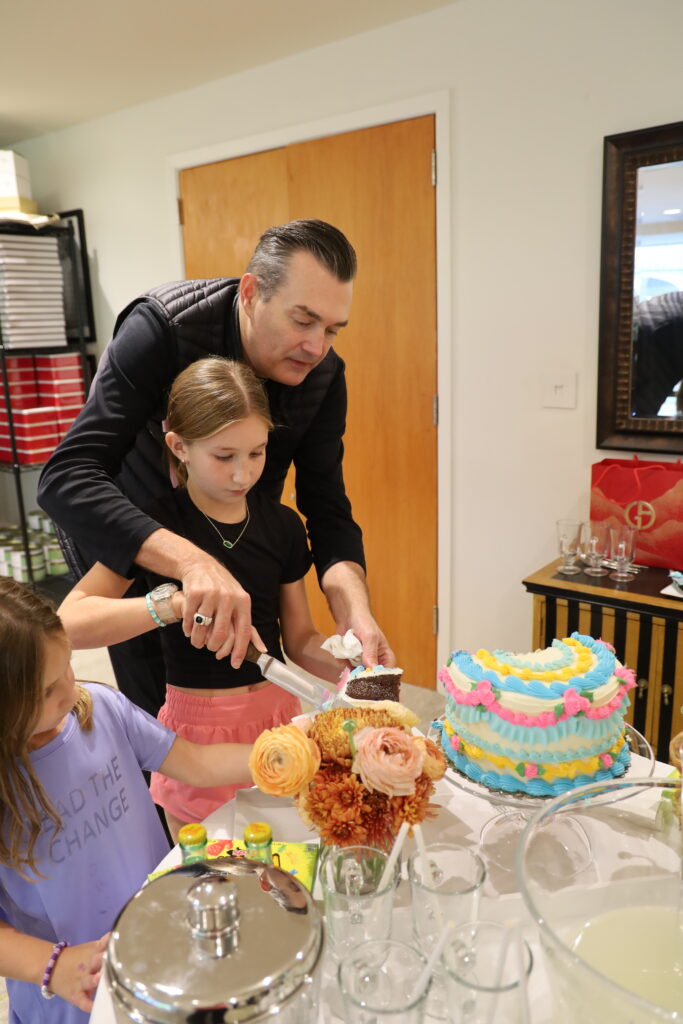 Alicia serves cake to her sister during the Birthday party session. 
