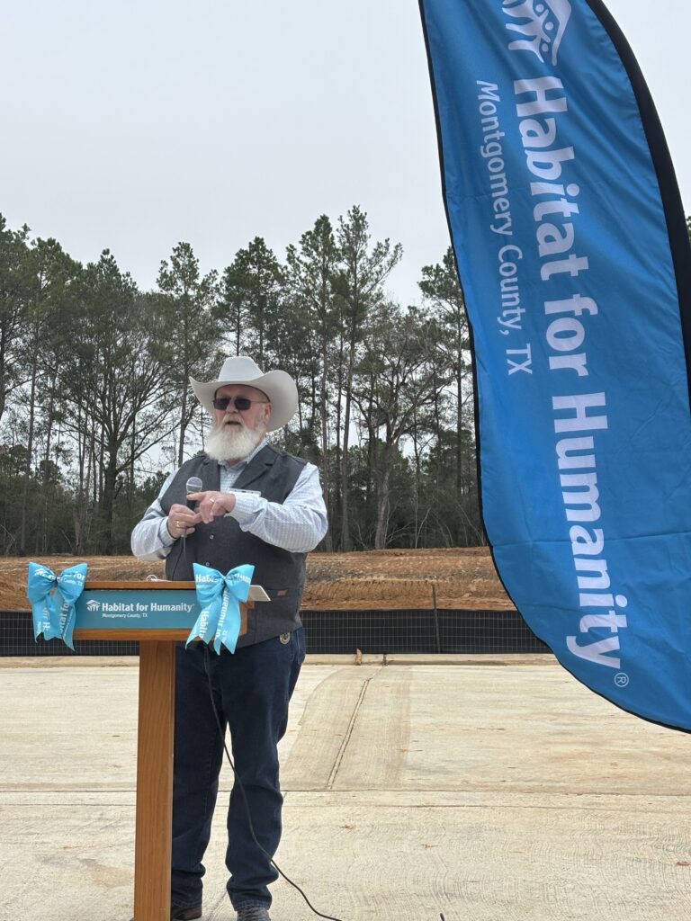 Montgomery County Precinct 2 Commissioner Charlie Riley told the crowd about working with Habitat and the land donation. (Photo by Laura Landsbaum)