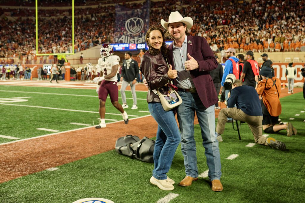 Stacey & Russell White, guests of Cotton Holdings, on the sidelines at the Lone Star Showdown (Photo Courtesy of Cotton Holdings) (Photo by Courtesy of Cotton Holdings)