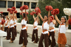 University of Texas Cheerleaders and Pom Squad at the Cotton Tailgate; photo courtesy of Cotton Holdings
