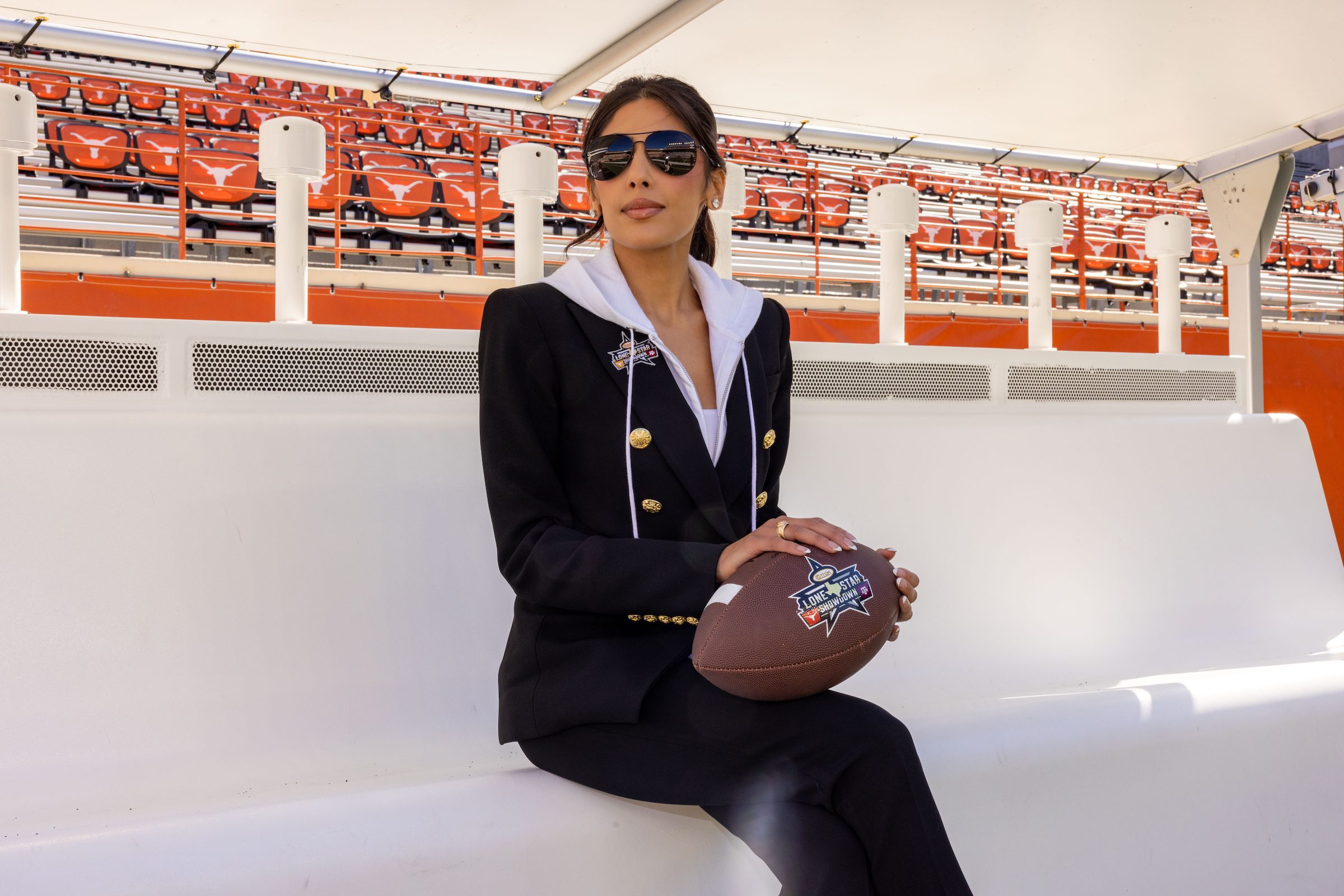 Zinat Ahmed with the custom branded Cotton Lone Star Showdown football by Lucchese; photo courtesy of Cotton Holdings (Photo by Photos Courtesy of Cotton Holdings)