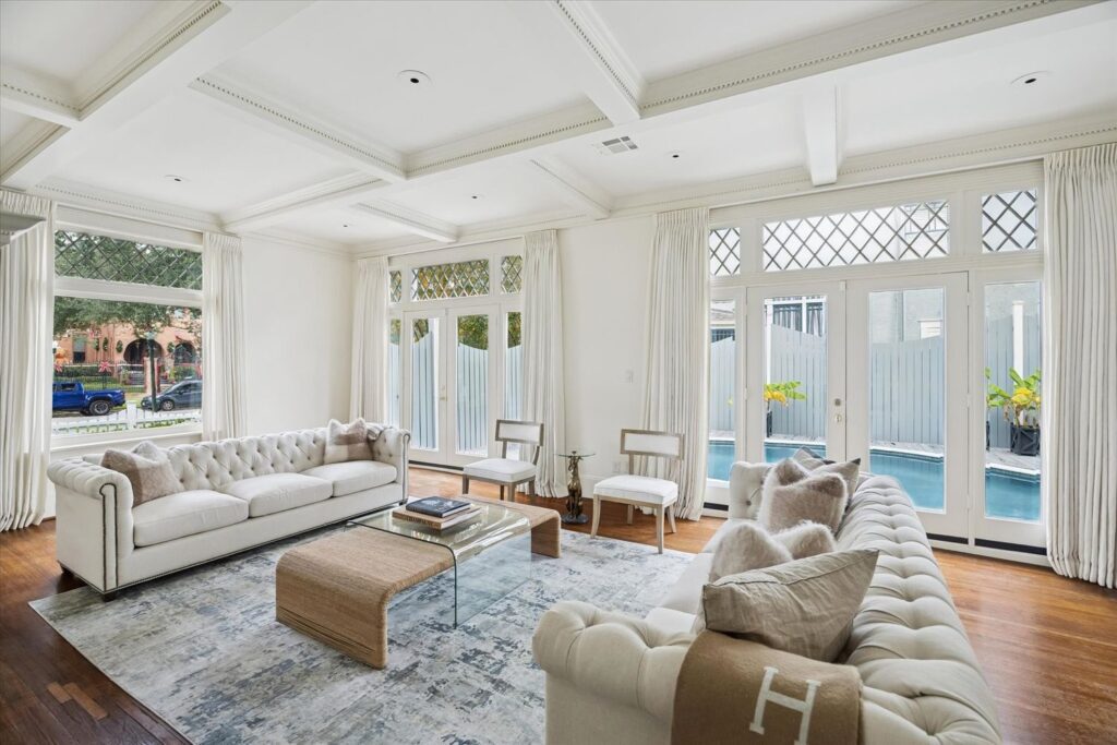 The spacious living room at 200 Westmoreland opens to the swimming pool, a modern addition to the 1905 home. (Photo by TK Images)