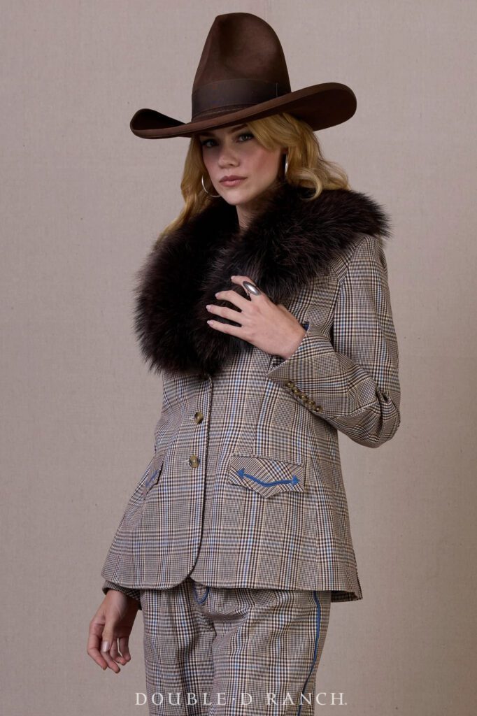 The Riding Habit Jacket by Double D Ranch is a tailored plaid silhouette finished with equestrian-inspired details. (Courtesy)