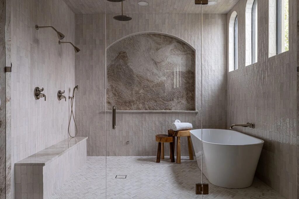 All four bedrooms offer en-suite bathrooms, of course, that are spacious and prime for luxuriating in a wintertime bath. (Photo by Compass RE Texas, LLC)