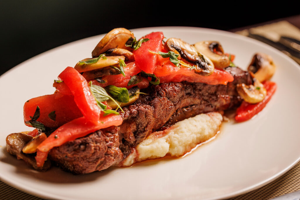 Bistecca Alla Pizzaiola is one of the many highlights on Urban Italia's menu. (Photo by Samantha Marie Photography)