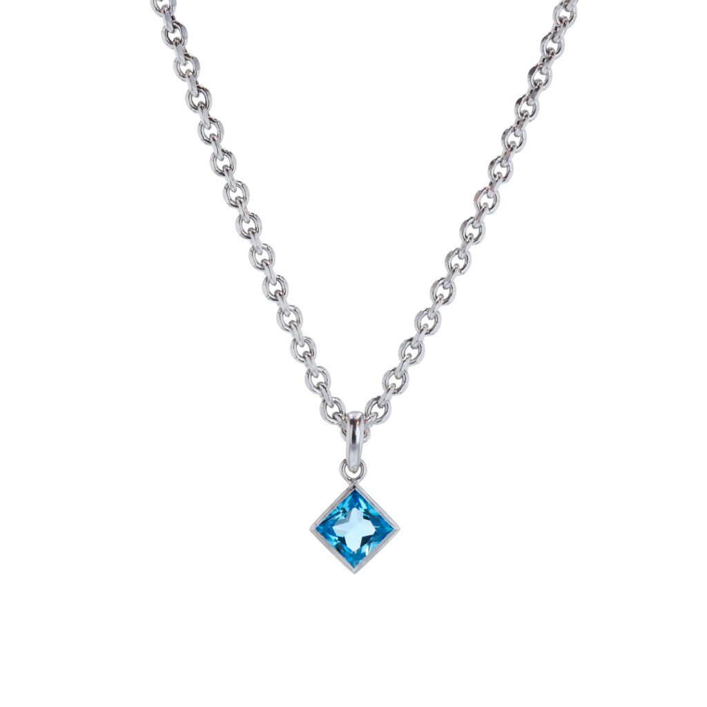 A blue topaz set in white gold on a diamond-cut cable chain by Zadok Jewelers for Houston Ballet principal Harper Watters. (Photo by Kaitlyn Pham)