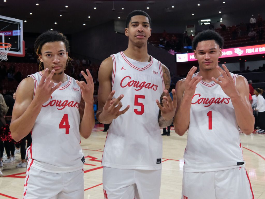 University of Houston's terrific trio of freshmen — starters Kingston Flemings and Chris Cenac Jr. and sixth man Isiah Harwell — share a moment. (Photo by F. Carter Smith)