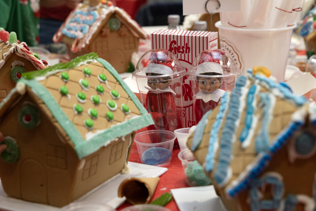 The premise of Cookies & Castles is simple: The Tri Delta gals supply everything you could possibly need to decorate a gingerbread house; you leave the mess behind. (Photo by Allison Slomowitz - Photographer, Scottish Rite for Children)