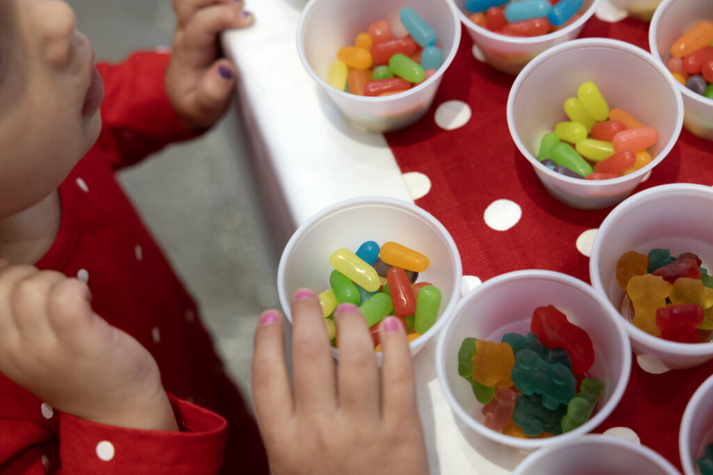 "Everything you could possibly need" includes a fully-assembled (sturdy!) gingerbread house, icing packets, and a buffet of 5,000 pounds of candy.  (Photo by Allison Slomowitz - Photographer, Scottish Rite for Children)