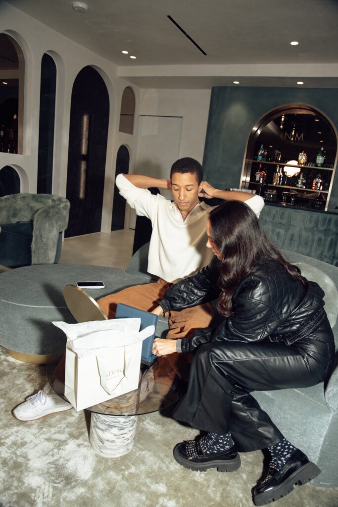 Amy Zadok of family-owned Zadok Jewelers presents Harper Watters with his personal collection of necklaces. (Photo by Kaitlyn Pham)