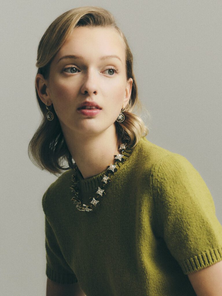 A model wearing the 11 Juillet diamond and emerald star motif necklace, crafted with 60 carats of diamonds and 40 carats of emeralds.  (Photo by Johnny Than)