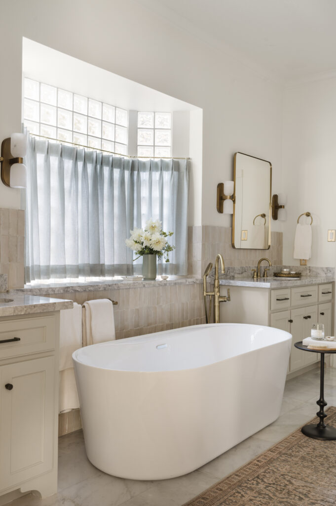 Cafe curtains covering the glass block window added softness to the room in this Palmer Woods renovation. (Photo by Madeleine Harper Photography)