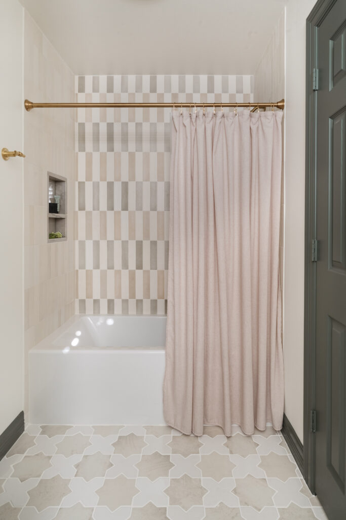 New tile, and fixtures refreshed this upstairs bath. (Photo by Madeleine Harper Photography)