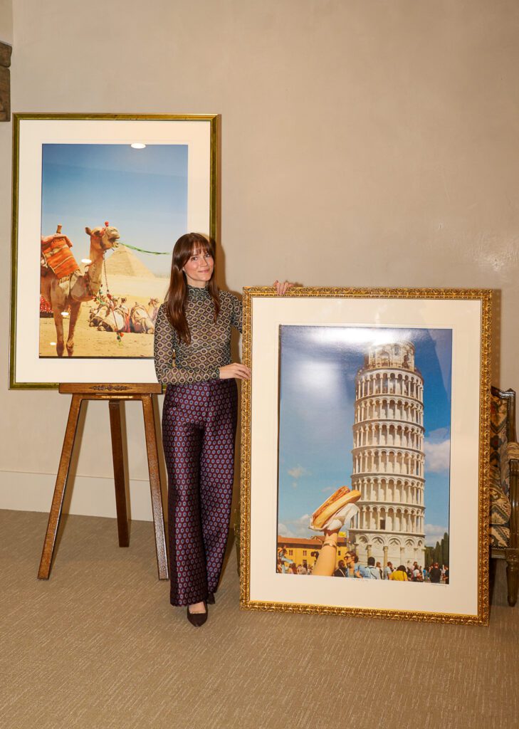 Photographer Christiana Reckling with 'Pisa, Hold My Dog' and 'Camel Toes' at her debut photographic exhibition  (Photo by Mia Bonner Photography)