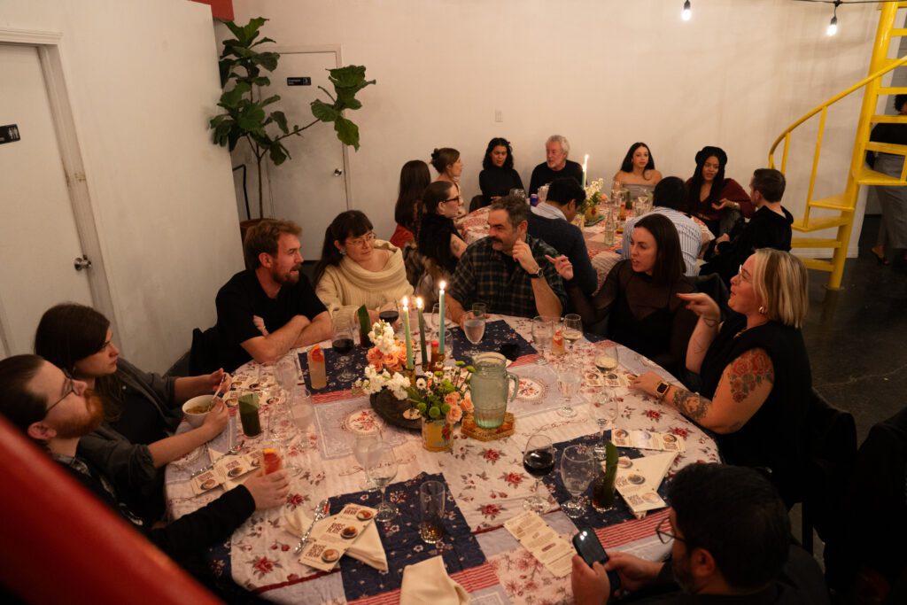 Guests enjoying dinner by Knives in Water (Photo by Alan Nguyen)