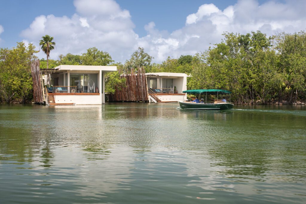 After motoring along the lagoon with a welcome cocktail in hand, the captain delivers you directly to your room. (Photo by Rosewood Mayakoba)