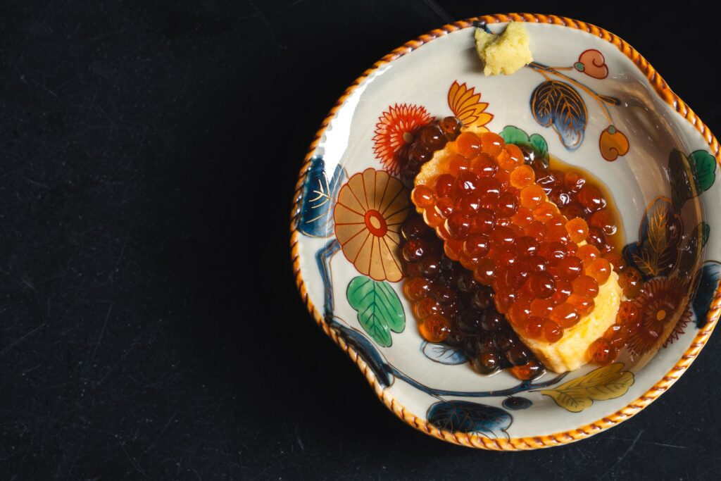 Indulge in the starter, tamago salmon roe ($15) composed with egg omelette and marinated salmon roe. (Photo by Photos courtesy of Comma Hospitality)