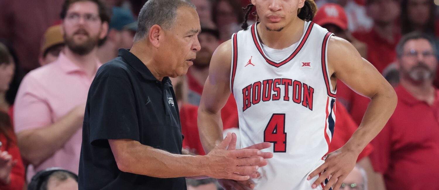Astros Manager Joe Espada and UH football coach Willie Fritz meet at halftime of the UH-Texas Tech Big XII basketball contest at the Fertitta Center, Tuesday, January 6, 2026