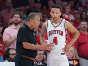 Astros Manager Joe Espada and UH football coach Willie Fritz meet at halftime of the UH-Texas Tech Big XII basketball contest at the Fertitta Center, Tuesday, January 6, 2026