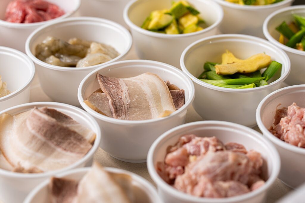 At iWok the machines don’t replace humans altogether. Far from it. The prep cooks in a central kitchen prepare fresh ingredients daily—chopping proteins, washing vegetables, and preparing sauces– before portioning each into individual containers and to be refrigerated for later use.