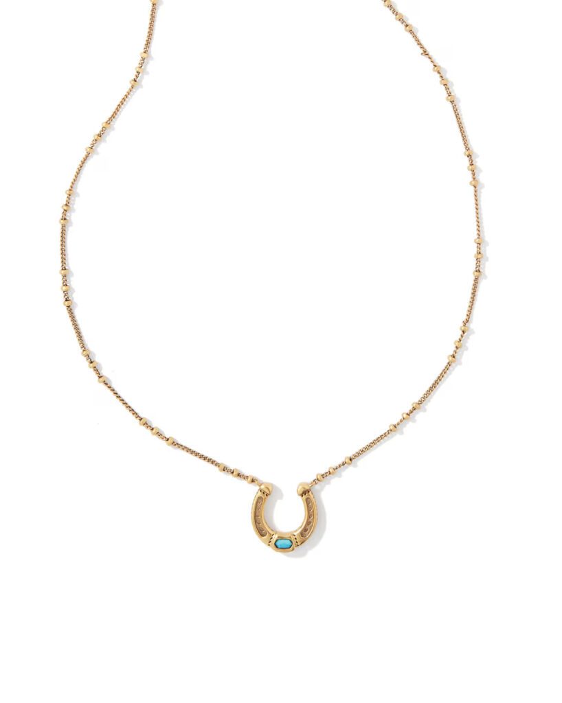 Kendra Scott's vintage gold horseshoe shoe is finished with a turquoise stone and is a subtle nod to Western luck. (Courtesy)