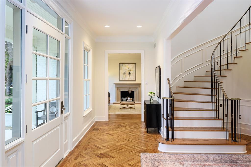 A stunning spiral staircase is a standout feature (Photo by Compass RE Texas, LLC)