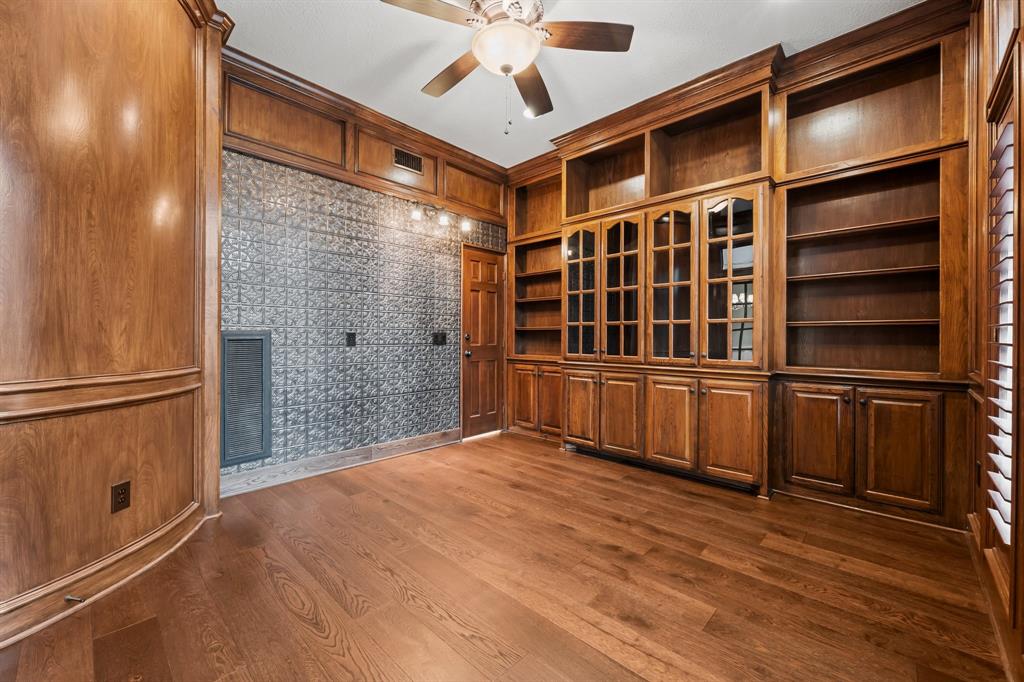 Before the Tiny Haven Design renovation, the office had a tin wall, and no bar area.  (Photo courtesy of HAR) (Photo by Madeleine Harper Photography)