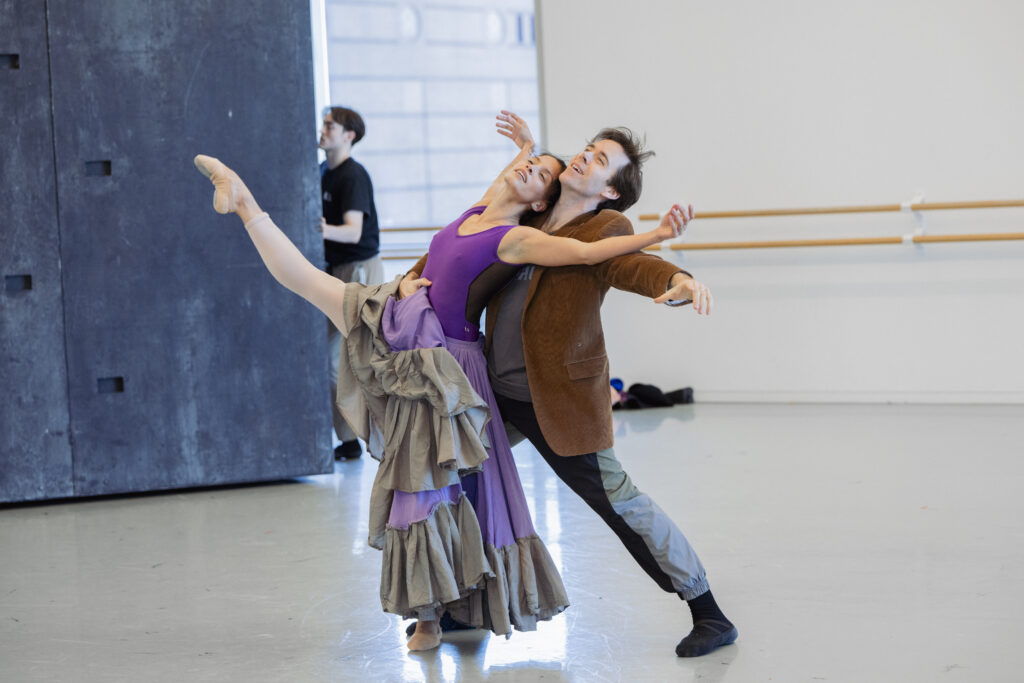 Houston Ballet principals Karina González as Frida Kahlo and Connor Walsh as Diego Rivera with corps de ballet dancer Riley McMurray rehearse Annabelle Lopez Ochoa’s “Broken Wings.” (Photo by Alana Campbell, 2026. Courtesy Houston Ballet.)