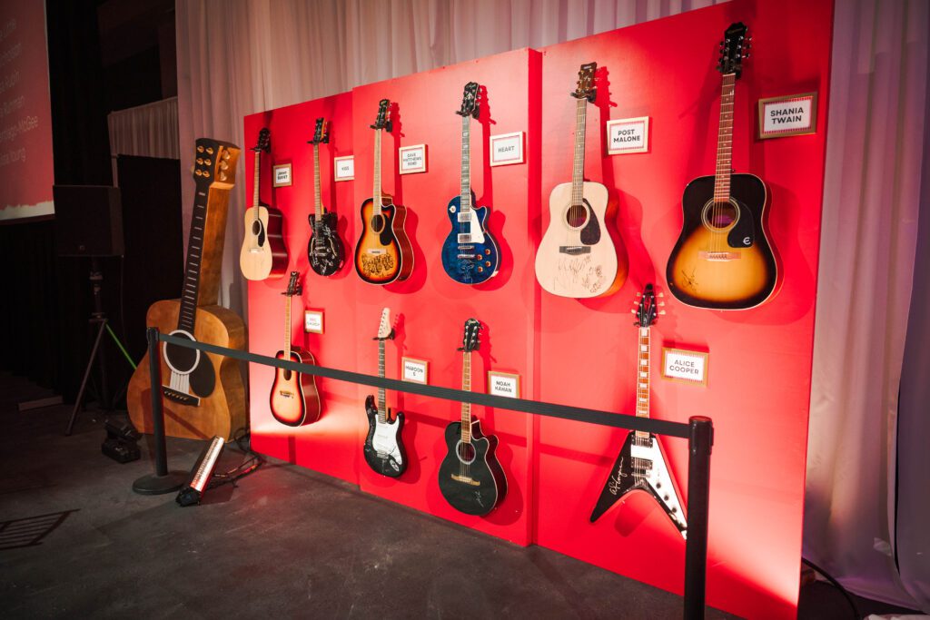 A guitar auction, including one signed by Post Malone, helped raise funds for the nonprofit’s mission. (Photo by The Cynthia Woods Mitchell Pavilion)