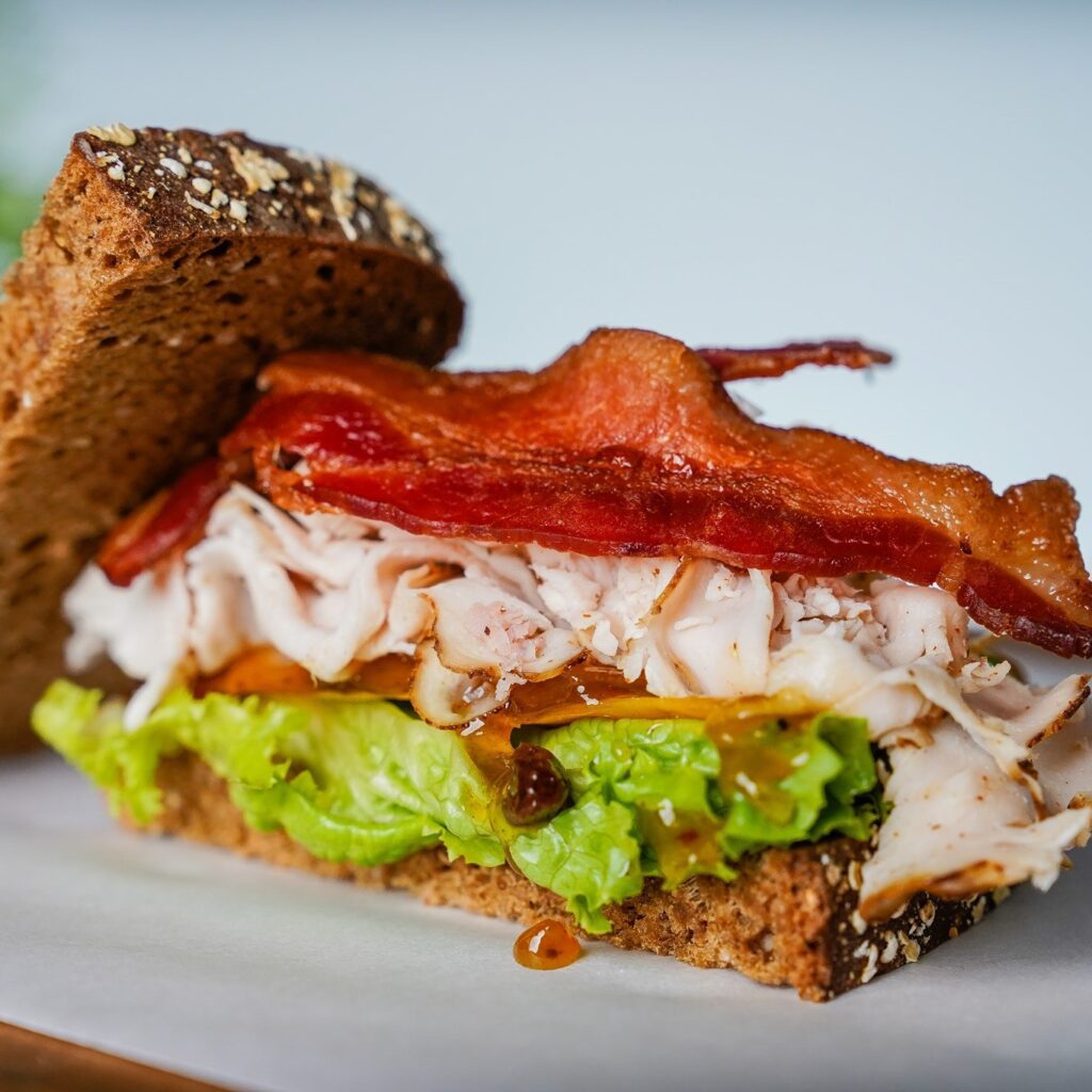 The "Katie Beth" Peach Gobbler at Hugs Cafe is a delicious turkey, bacon, cheddar cheese, lettuce, and house-made peach chutney creation. (Courtesy)