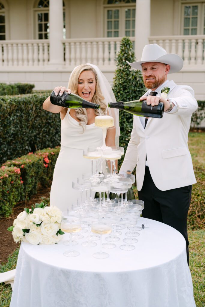 A champagne tower at the end of the aisle was one of Claudine Said's favorite parts of her wedding to chef Austin Simmons. (Photo by Weddings by Trey)