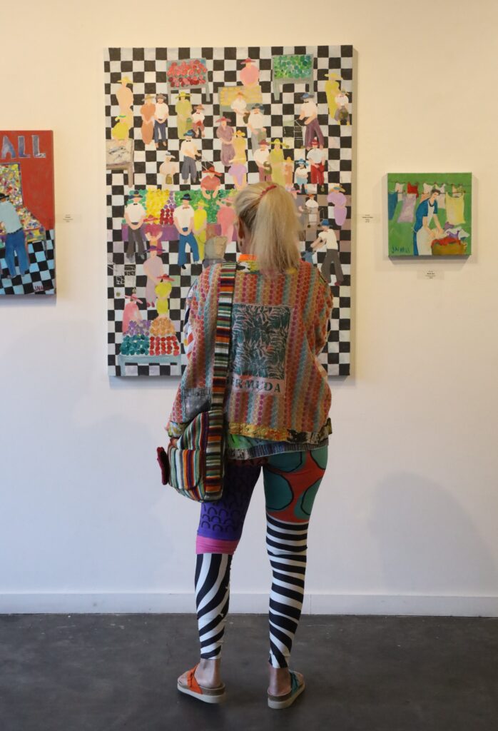 During an evening at Archway Gallery, it's common to see a visitor pause in front of a work, taking in its details in a quiet moment of reflection. (Photo courtesy Archway Gallery)