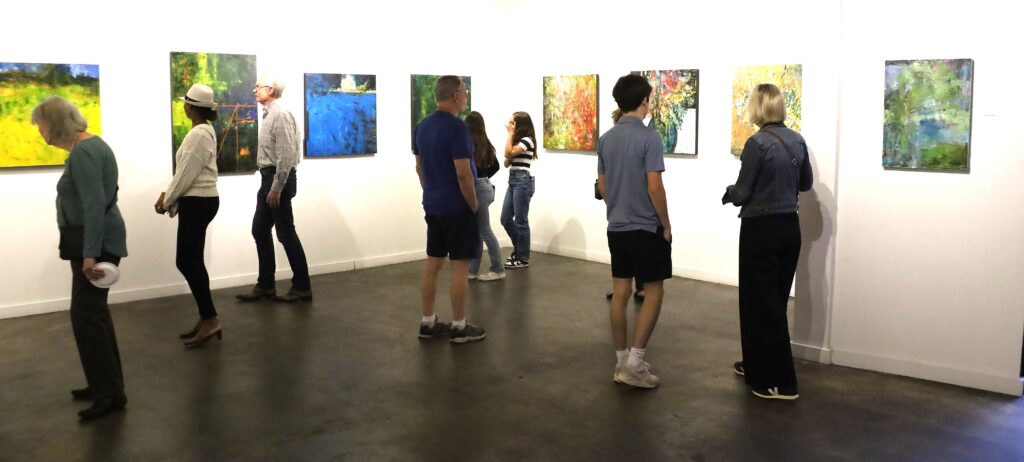 Gallery-goers drift through Archway Gallery’s exhibition featuring Houston artist Margaret Miller. (Photo courtesy Archway Gallery)
