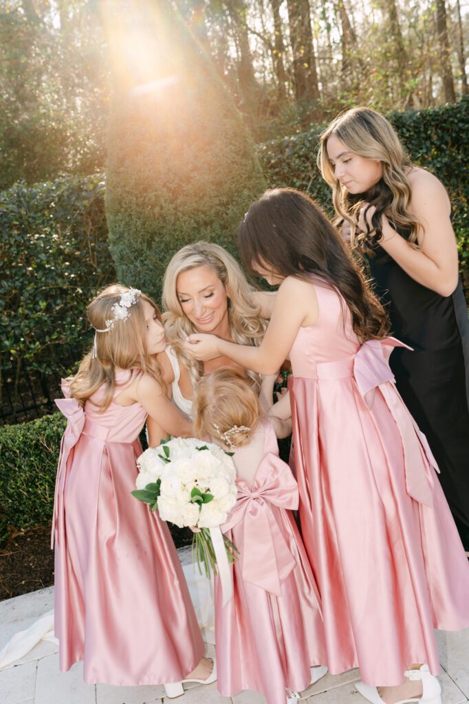 Claudine Said and Austin Simmons' four youngest daughters were flower girls, while the oldest girl was a bridesmaid in their wedding. (Photo by Weddings by Trey)