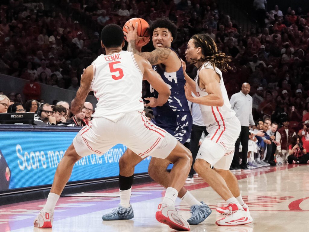 University of Houston players Chris Cenac Jr. and Emanuel Sharp know how to defend. (Photo by F. Carter Smith)