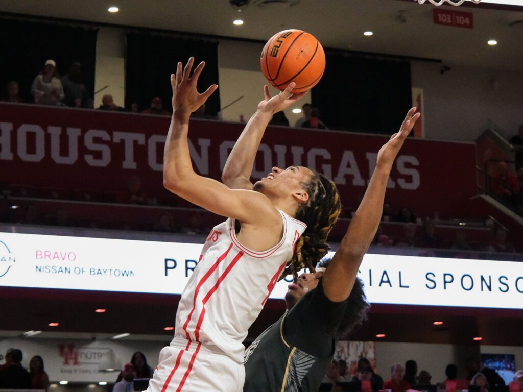 It's hard to keep Houston wonder freshman point guard Kingston Flemings from finishing at the rim. (Photo by F. Carter Smith) 