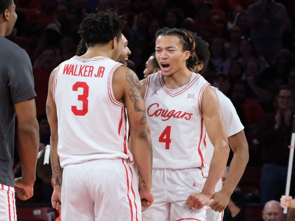 University of Houston veteran Ramon Walker Jr. celebrates with freshman point guard Kingston Flemings. (Photo by F. Carter Smith)