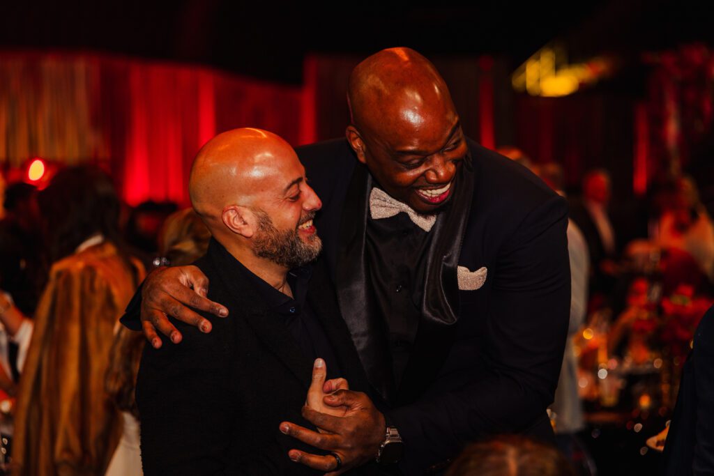 Houston Rockets general manager Rafael Stone and former Rockets player Carl Landry enjoy a moment at the 'Heart of a Champion' gala.