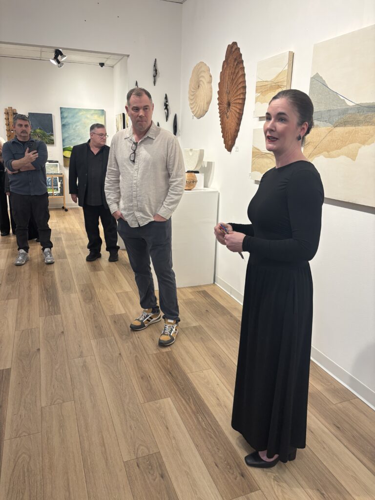 Guest juror Benji Stiles and gallery owner Julie Verville introduce the show “Material Matters.” (Photo by Laura Landsbaum)