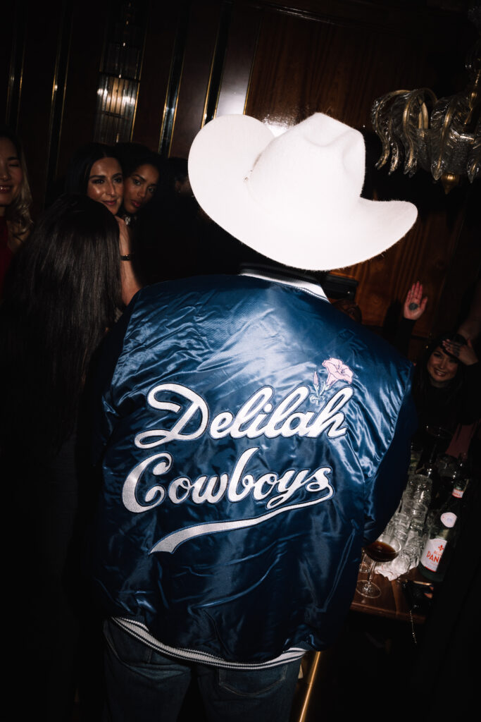 Leon Bridges rocking a Delilah Cowboys jacket. (Photo by Chase Hall Photography)
