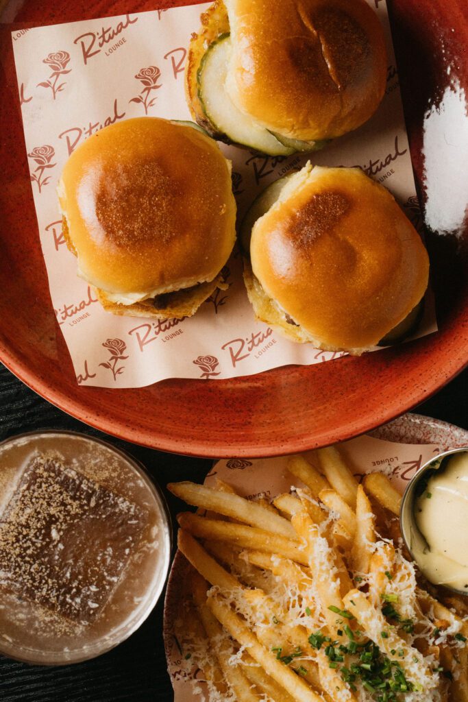A small bites menu at Ritual features shared plates like sliders and truffle parmesan fries. (Courtesy)