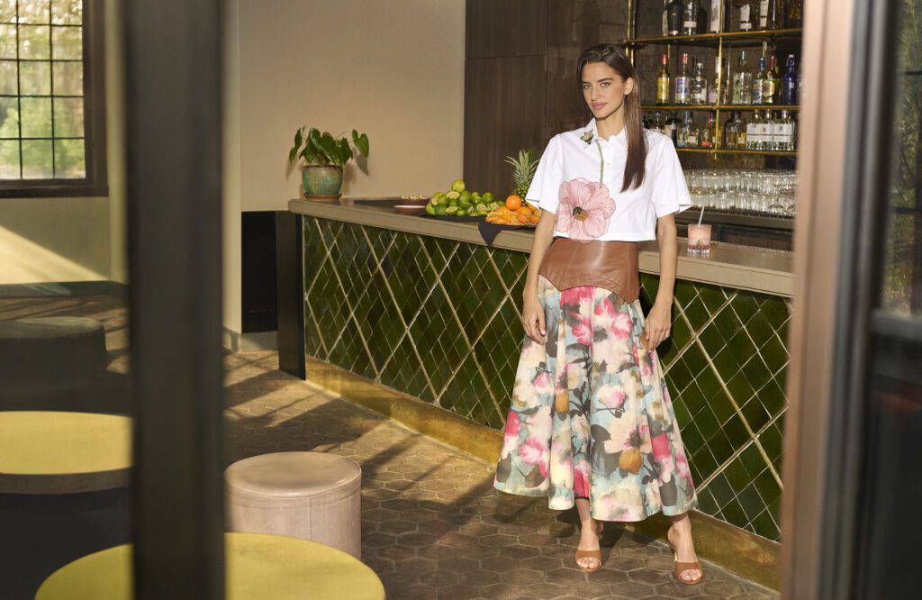 Lela Rose offers a beautifully designed floral floor length skirt accented with leather and paired with a pink floral appliqué top. (Photographed at Monkey Bar)